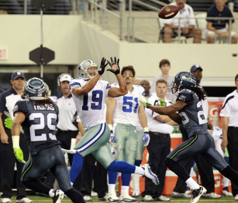 Dallas Cowboys wide receiver Miles Austin (19) makes a catch in front of Seattle Seahawks...