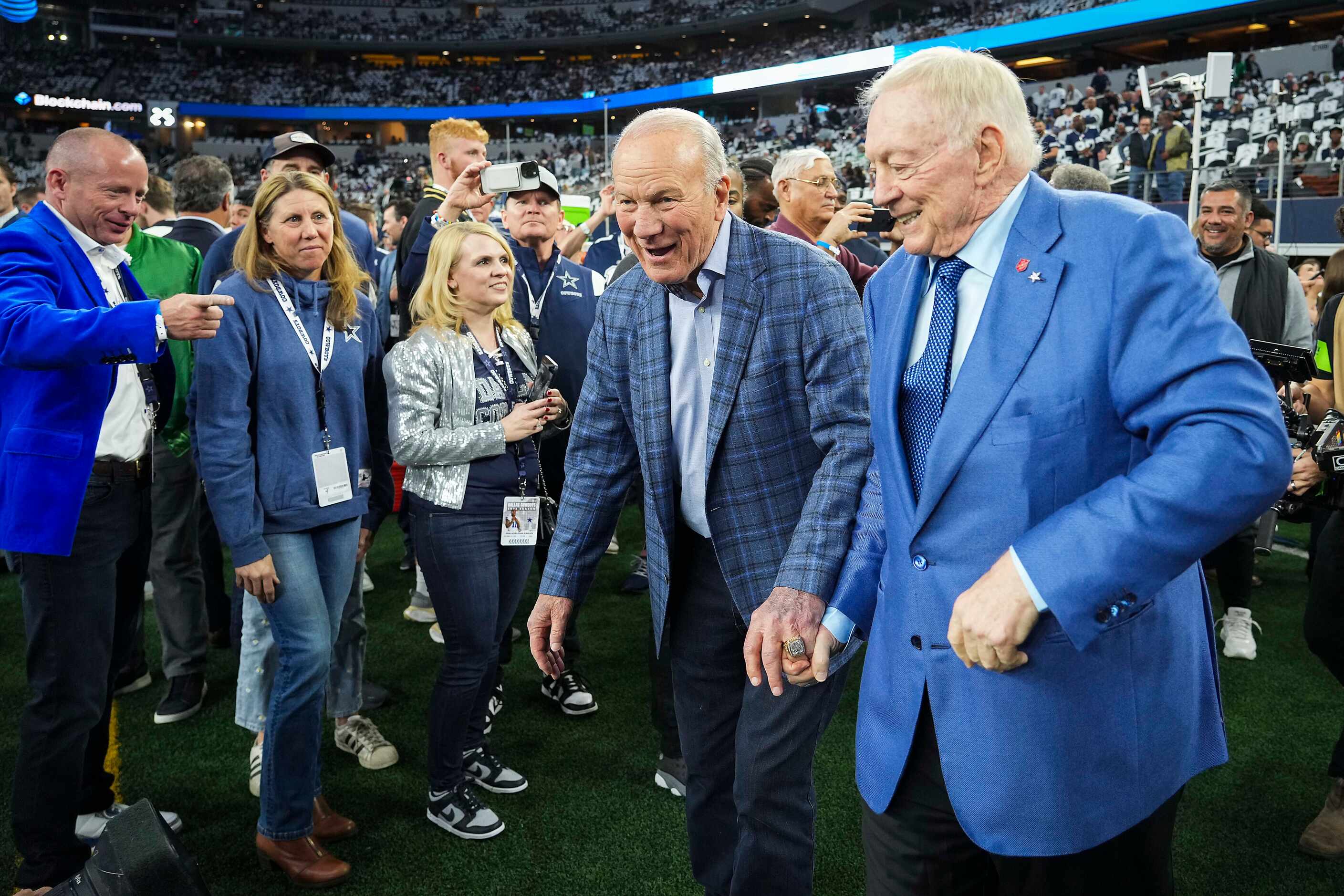Dallas Cowboys owner and general manager Jerry Jones (right) greets former Cowboys and...