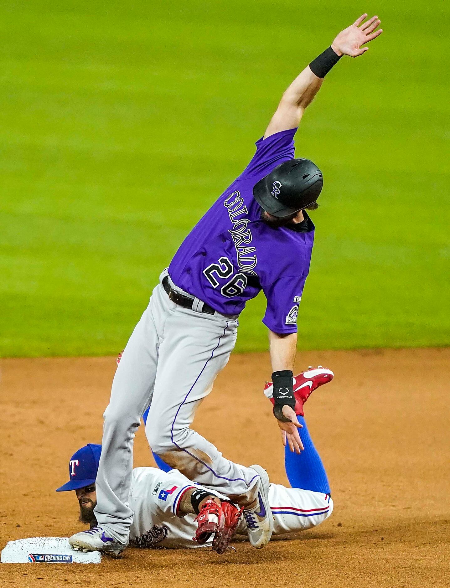 Colorado Rockies outfielder David Dahl advances to second base on a fly ball off the bat of...