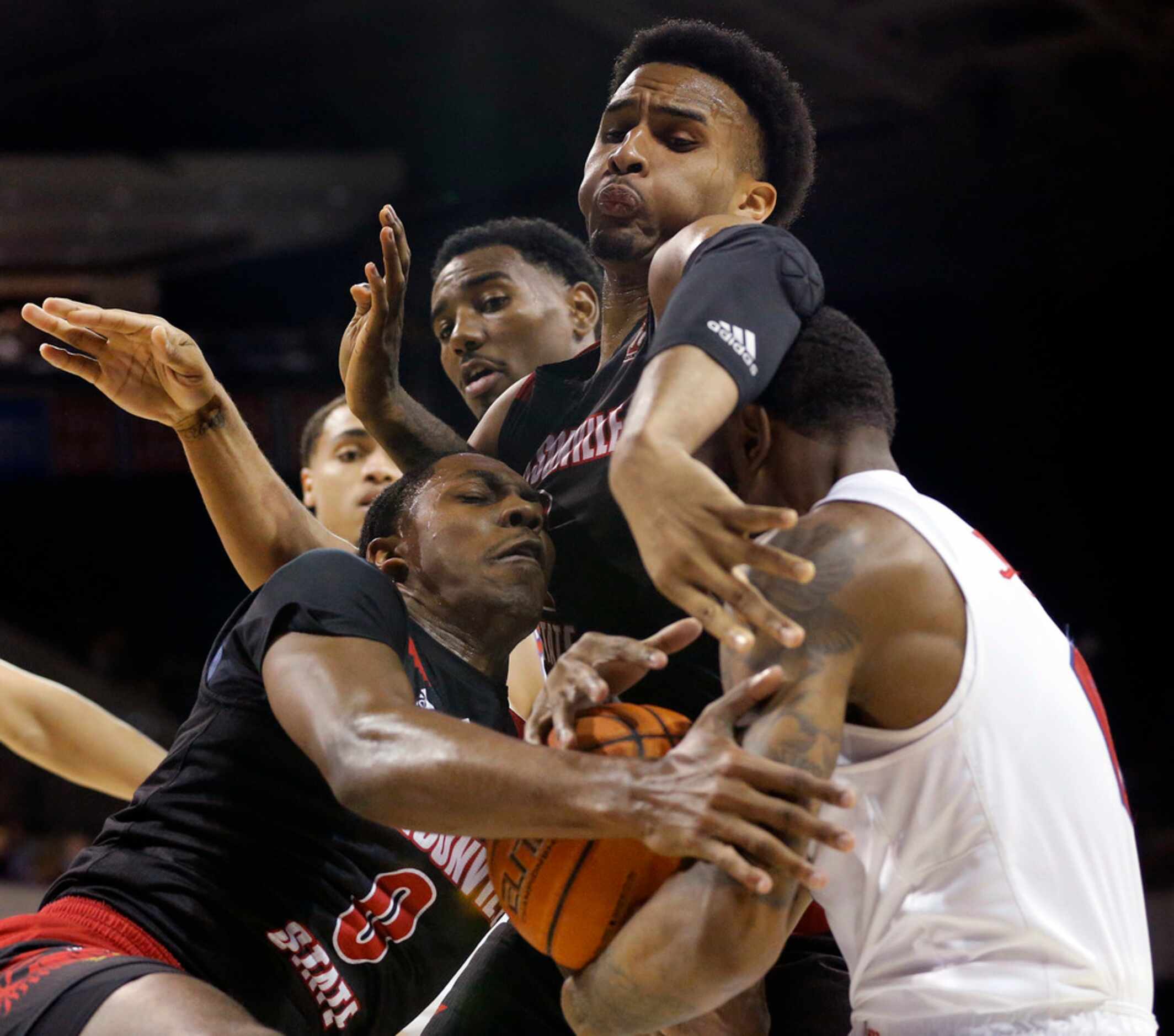 Southern Methodist Mustangs guard Tyson Jolly (0) is hammered by Jacksonville State...