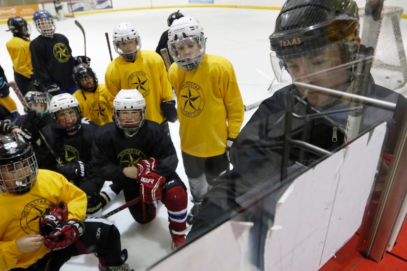 
Coach Kelly Dennis gives instruction to players during a Northstar Hockey Club camp. 
