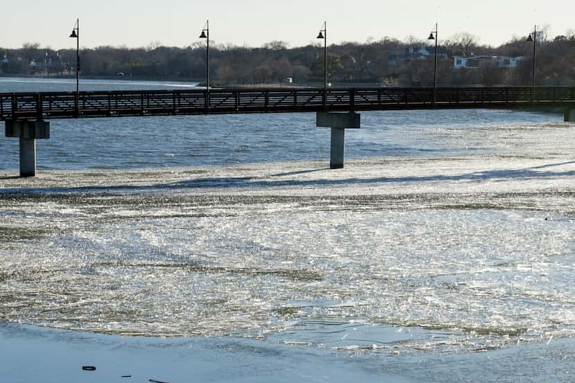 Ice sits atop White Rock Lake, Wednesday, Jan. 17, 2024, in Dallas. Temperatures were below...