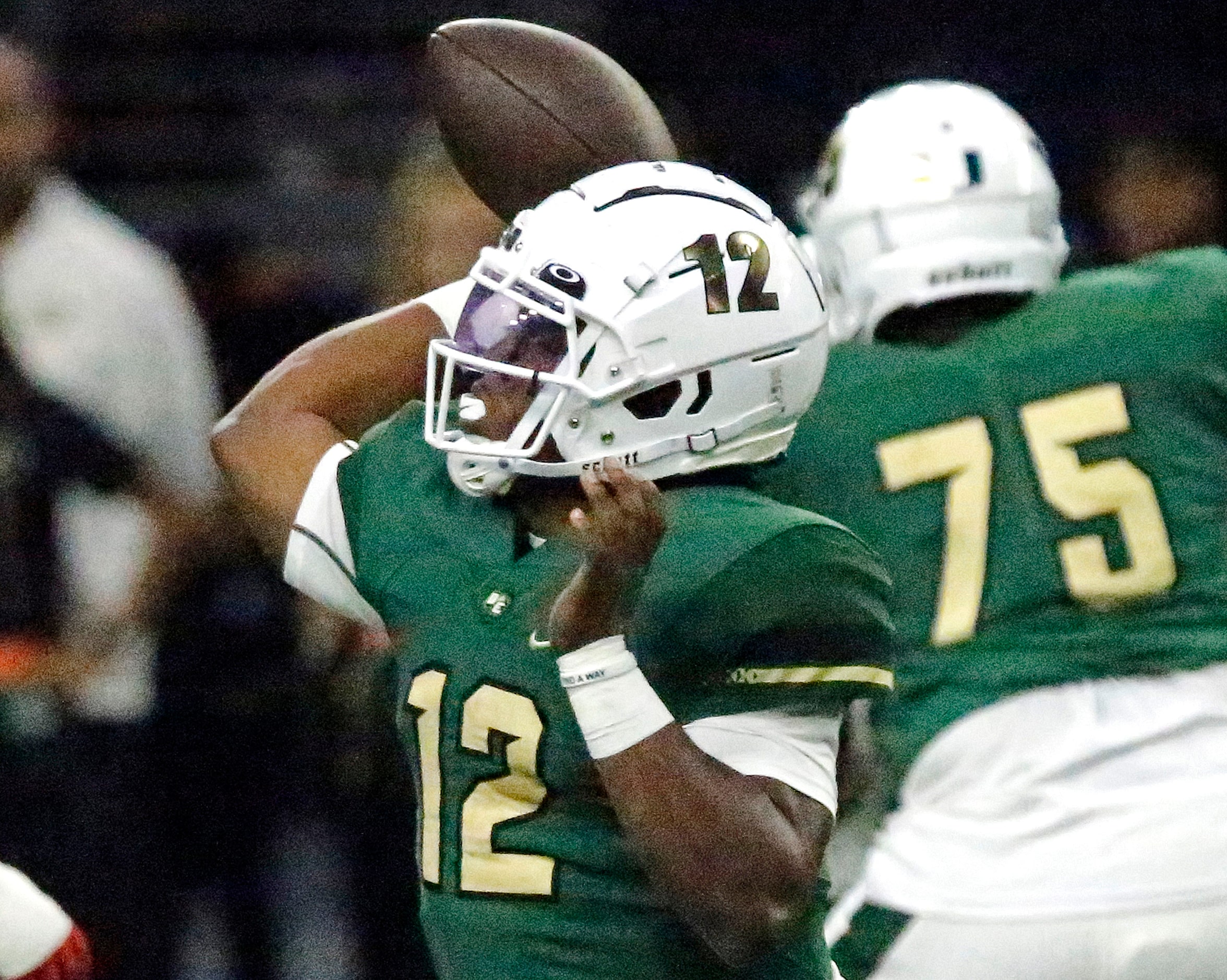 DeSoto High School quarterback Matthew Allen (12) throws a pass during the first half as...