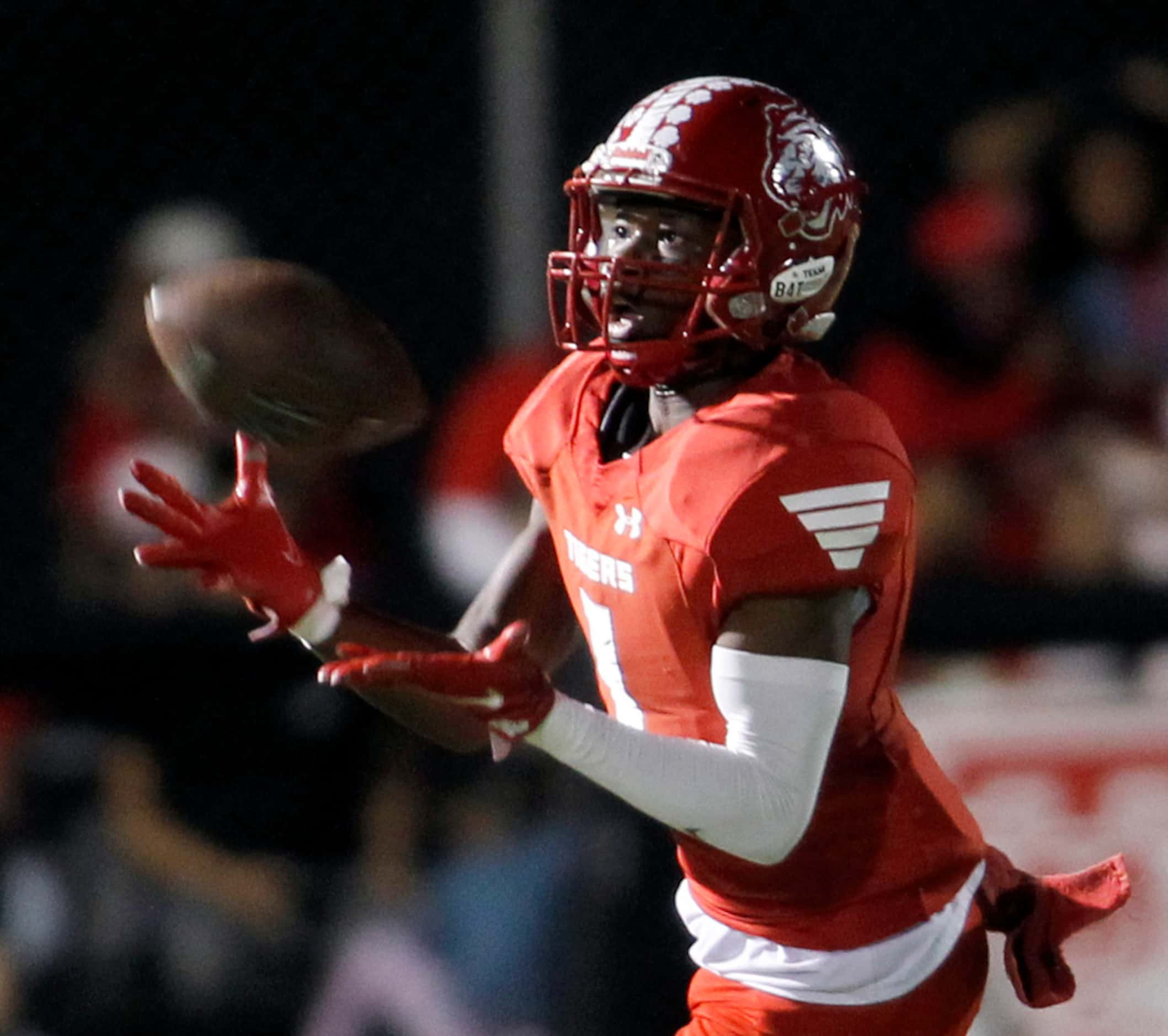 Terrell's Kanye Nix (1) focuses as he pulls in a punt and tacks on a return during first...