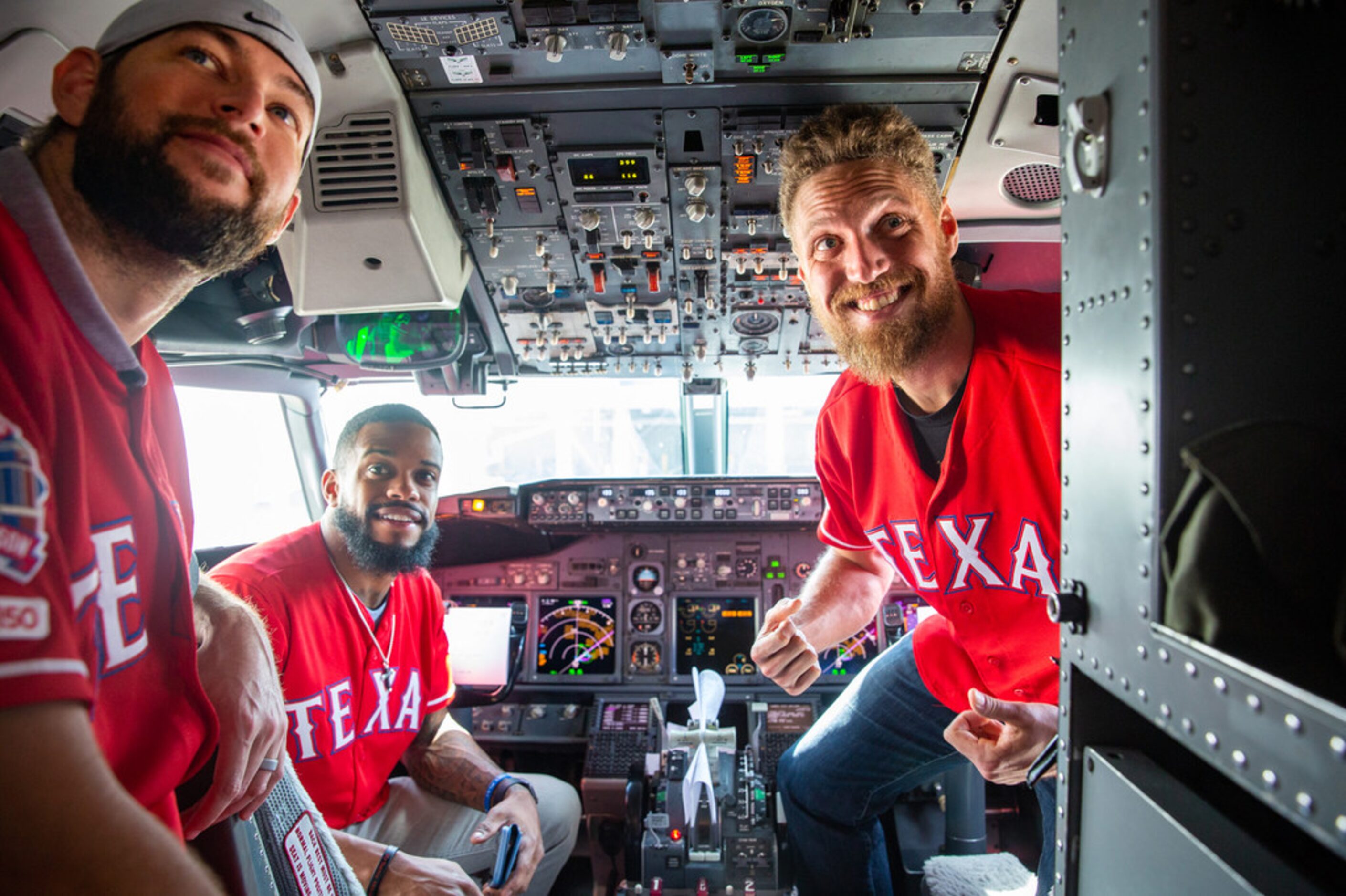 From left, Texas Rangers players Chris Martin, Delino DeShields Jr. and Hunter Pence check...