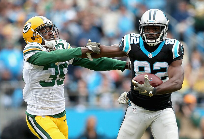 CHARLOTTE, NC - NOVEMBER 08:   Demetri Goodson #39 of the Green Bay Packers tries to tackle...