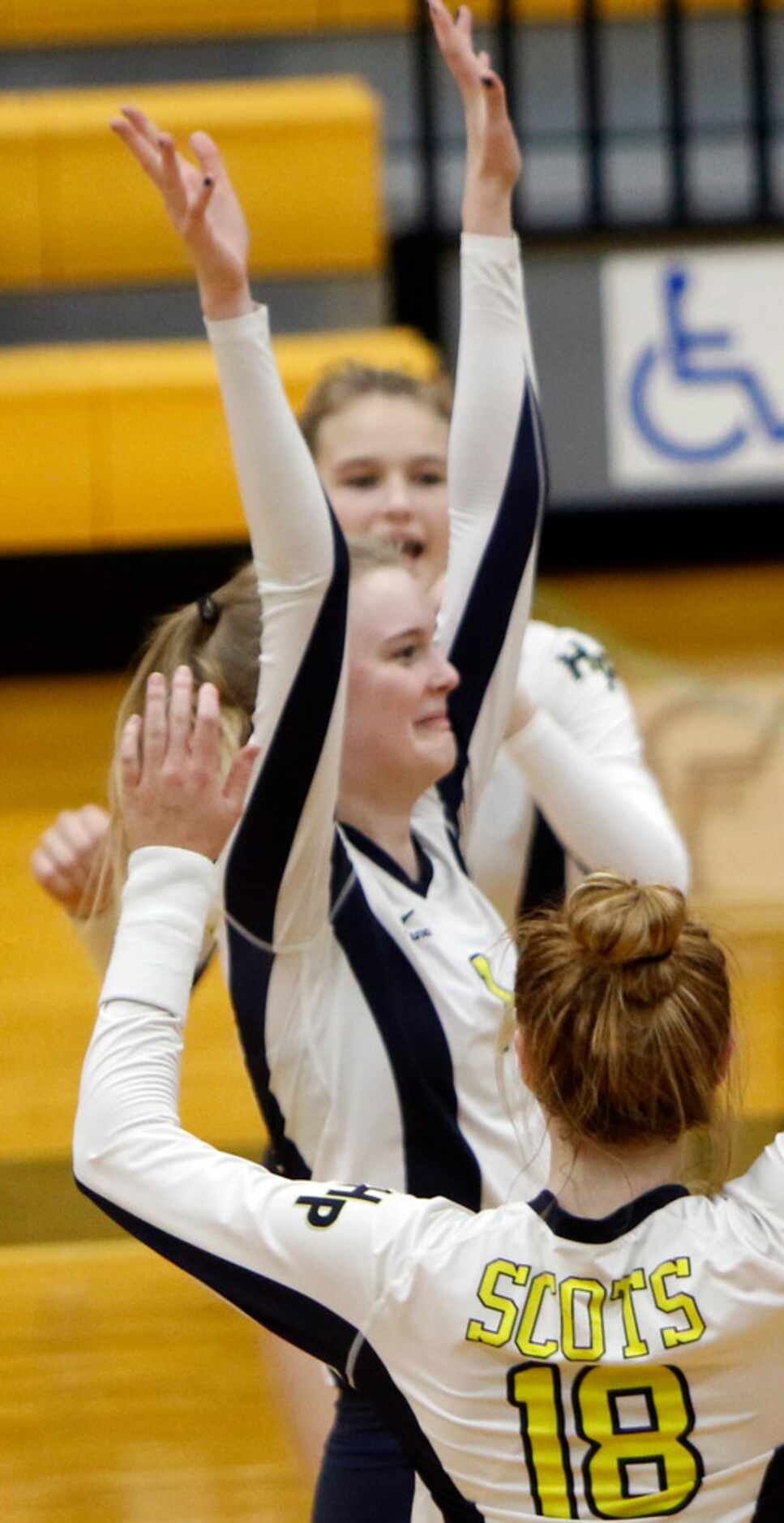 Highland Park middle hitter Avery Hellmuth (1) was all smiles as she throws her arms in the...