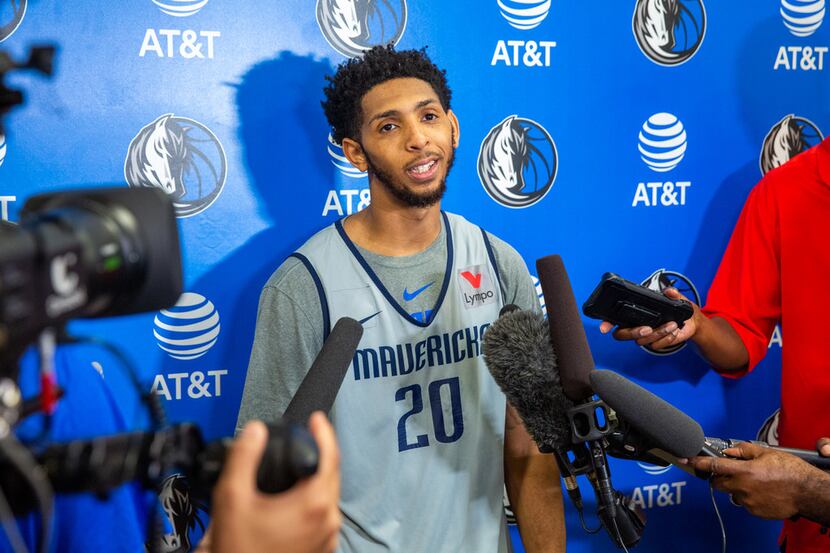 Cameron Payne, guard for the Mavericks summer league team, speaks to reporters after...