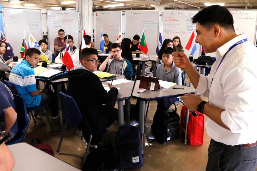 Daniel Mejia (right) teaches Spanish to ninth-graders at CityLab High School on the first...