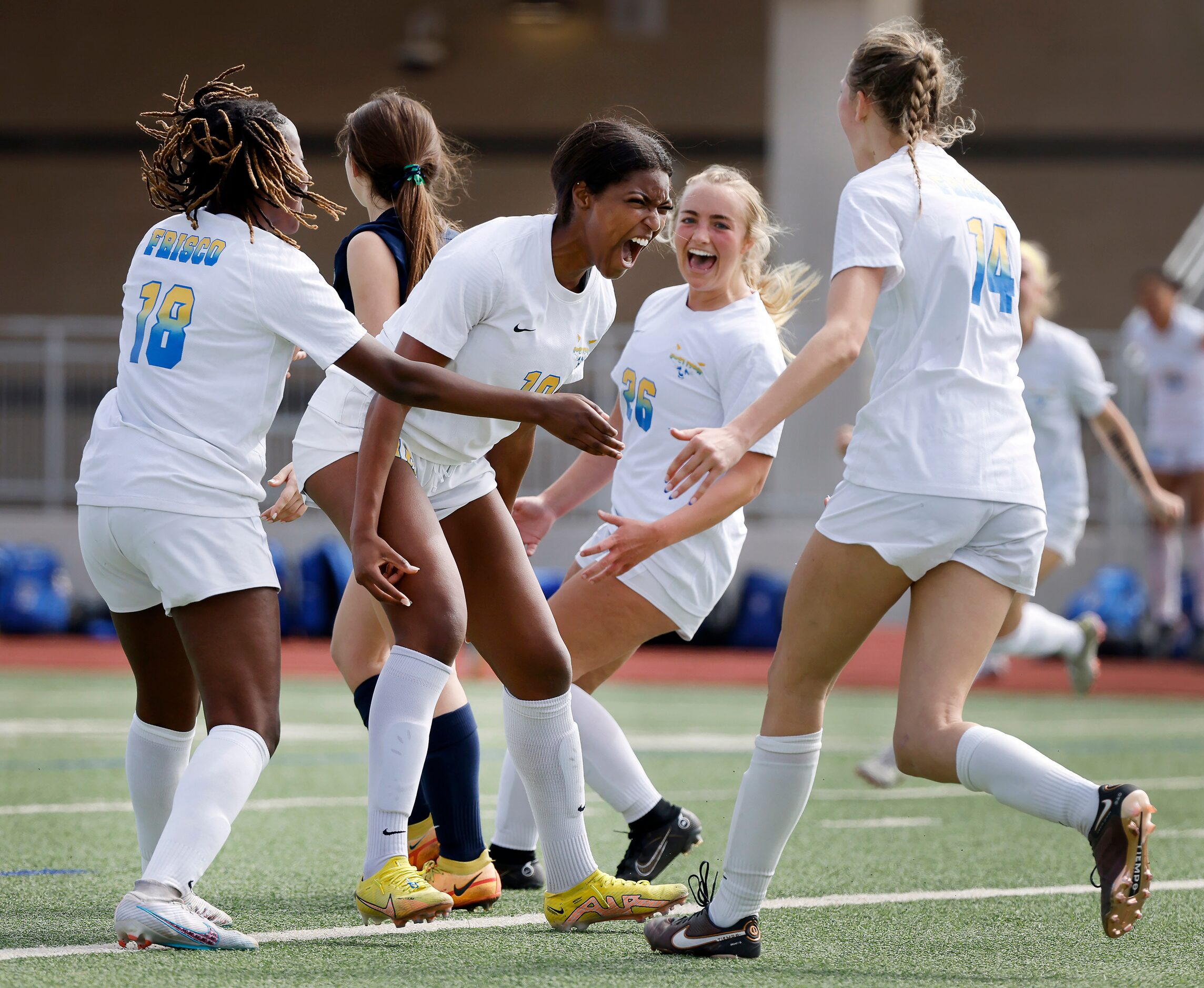 Frisco forward Kori Ballard (19, center) screams as she is congratulated by teammates London...