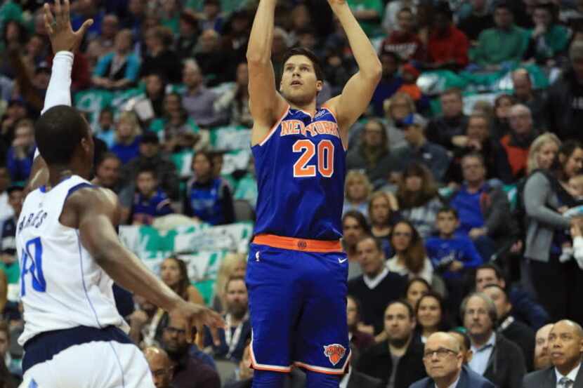 DALLAS, TX - JANUARY 07:  Doug McDermott #20 of the New York Knicks takes a shot against the...