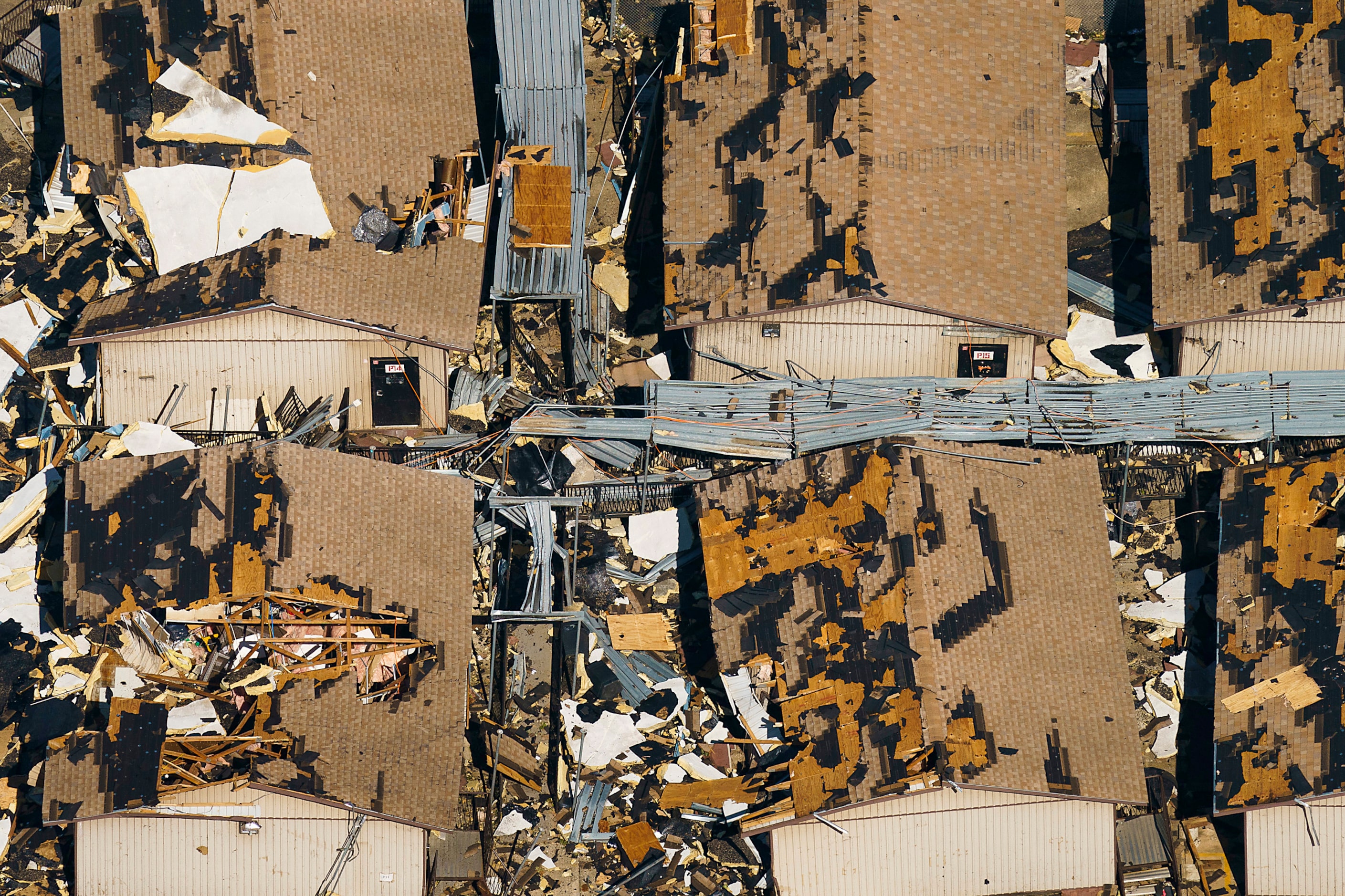 Temporary classroom are seen buried in rubble at Thomas Jefferson High School on Monday,...