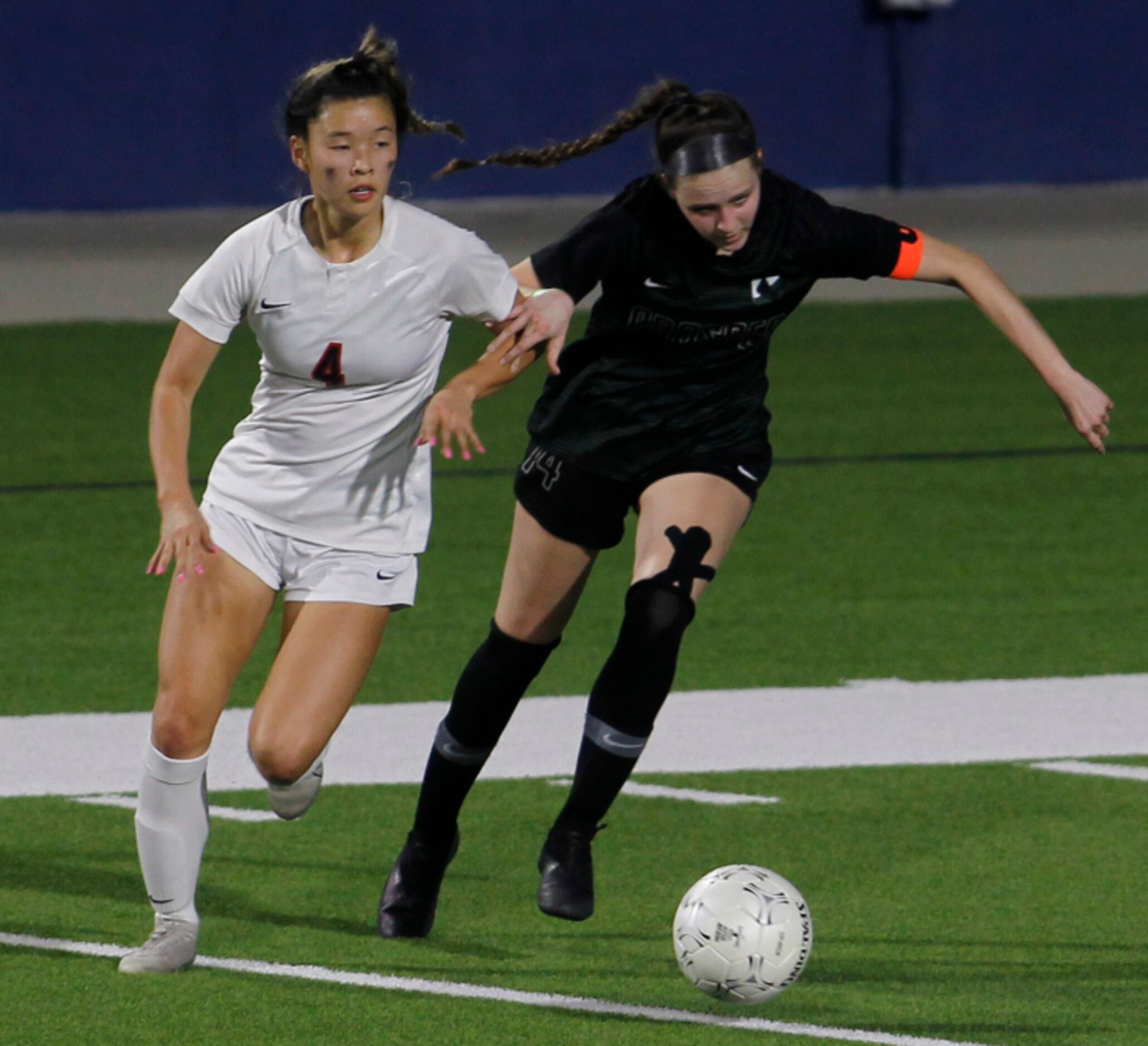 Prosper's Lauren Holland (14), right, and Coppell's Michelle Pak (4) battle for ball...