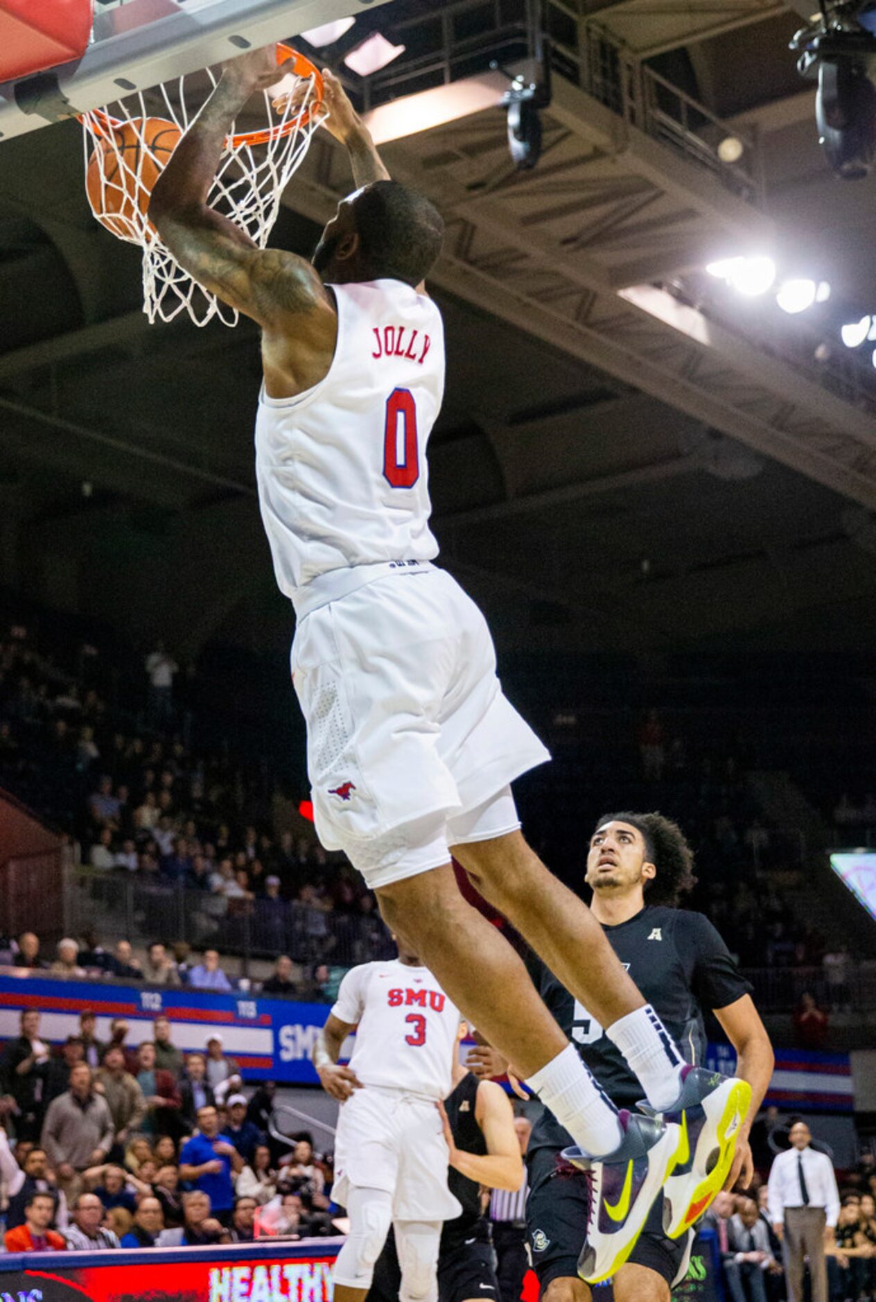 Southern Methodist Mustangs guard Tyson Jolly (0) goes up for a slam dunk in the final...