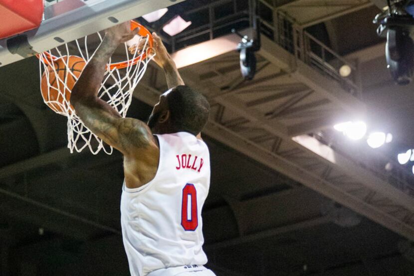 Southern Methodist Mustangs guard Tyson Jolly (0) goes up for a slam dunk in the final...