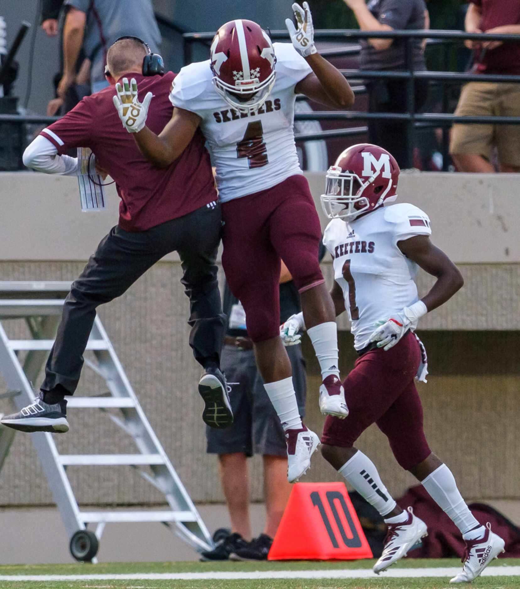 Mesquite running back LaDarius Turner (4) celebrates with head coach Jeff Fleener after...