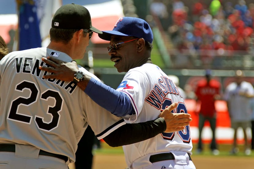 Texas Rangers left fielder Josh Hamilton (left) is congratulated by teammates after scoring...