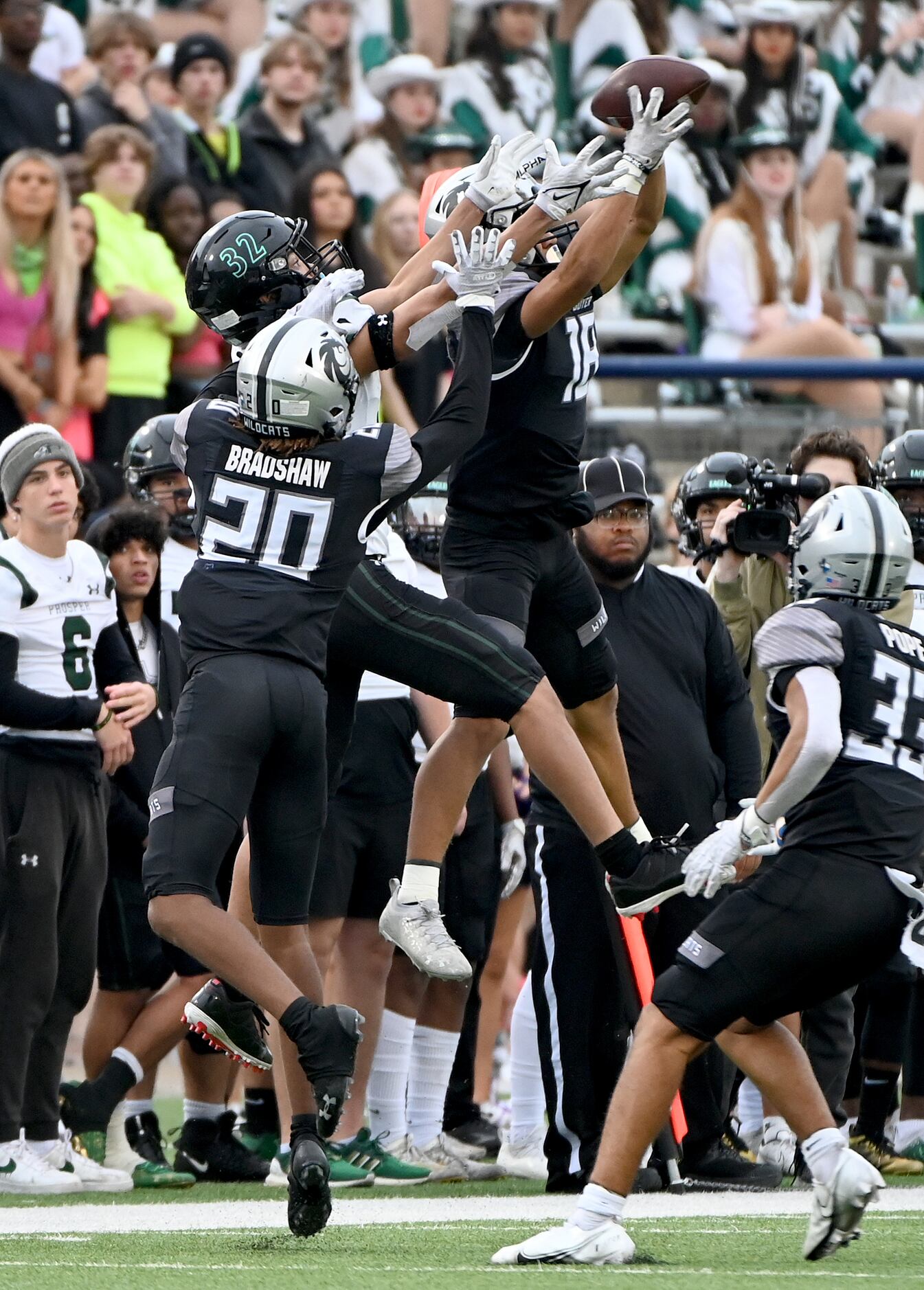 Denton Guyer's Eli Bowen (18) grabs an interception on a pass intended for Prosper Jordan...