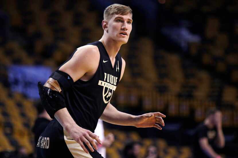 Purdue's Isaac Haas, wearing an arm brace, awaits a pass during practice at the NCAA men's...