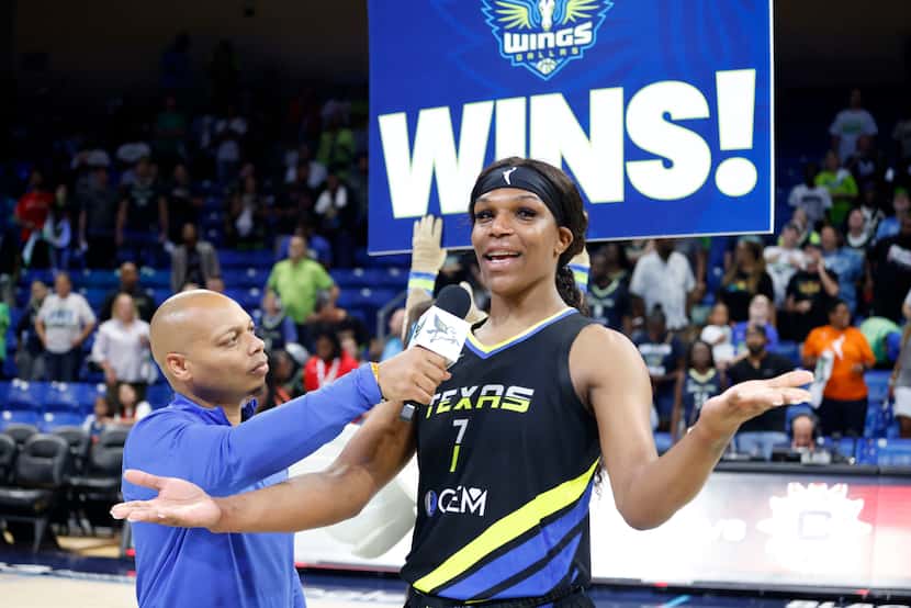 J. Harris interviews Dallas Wings center Teaira McCowan (7) after they defeated the Atlanta...