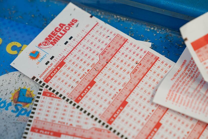 Unused lottery tickets can be seen inside a 7-Eleven store in Oakland, Calif., Tuesday, July...