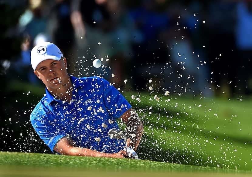  Jordan Spieth hits a shot from a sand trap along the 10th green during the final round of...