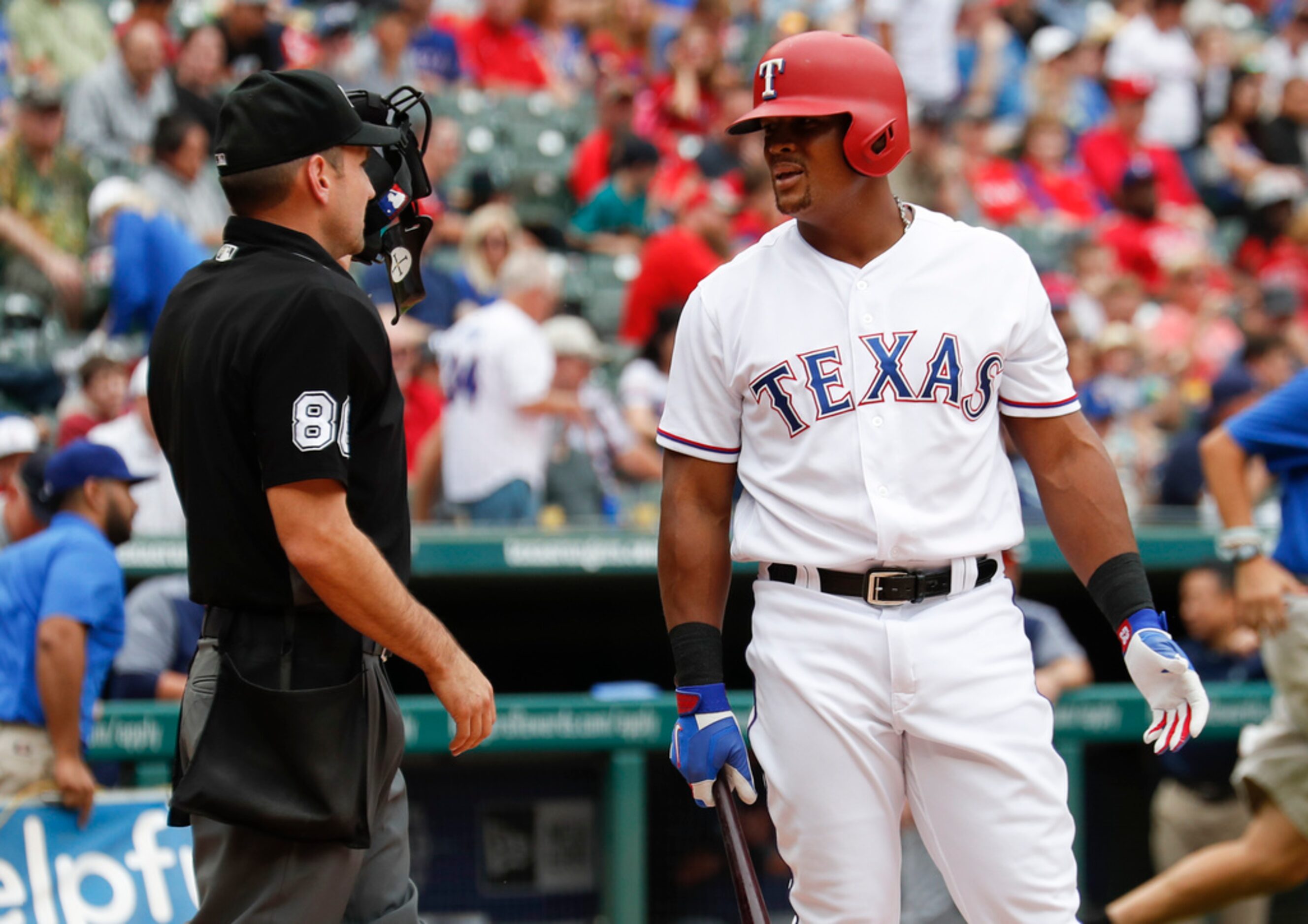 Texas Rangers' Adrian Beltre, right, questions home plate umpire David Rackley (86) after a...