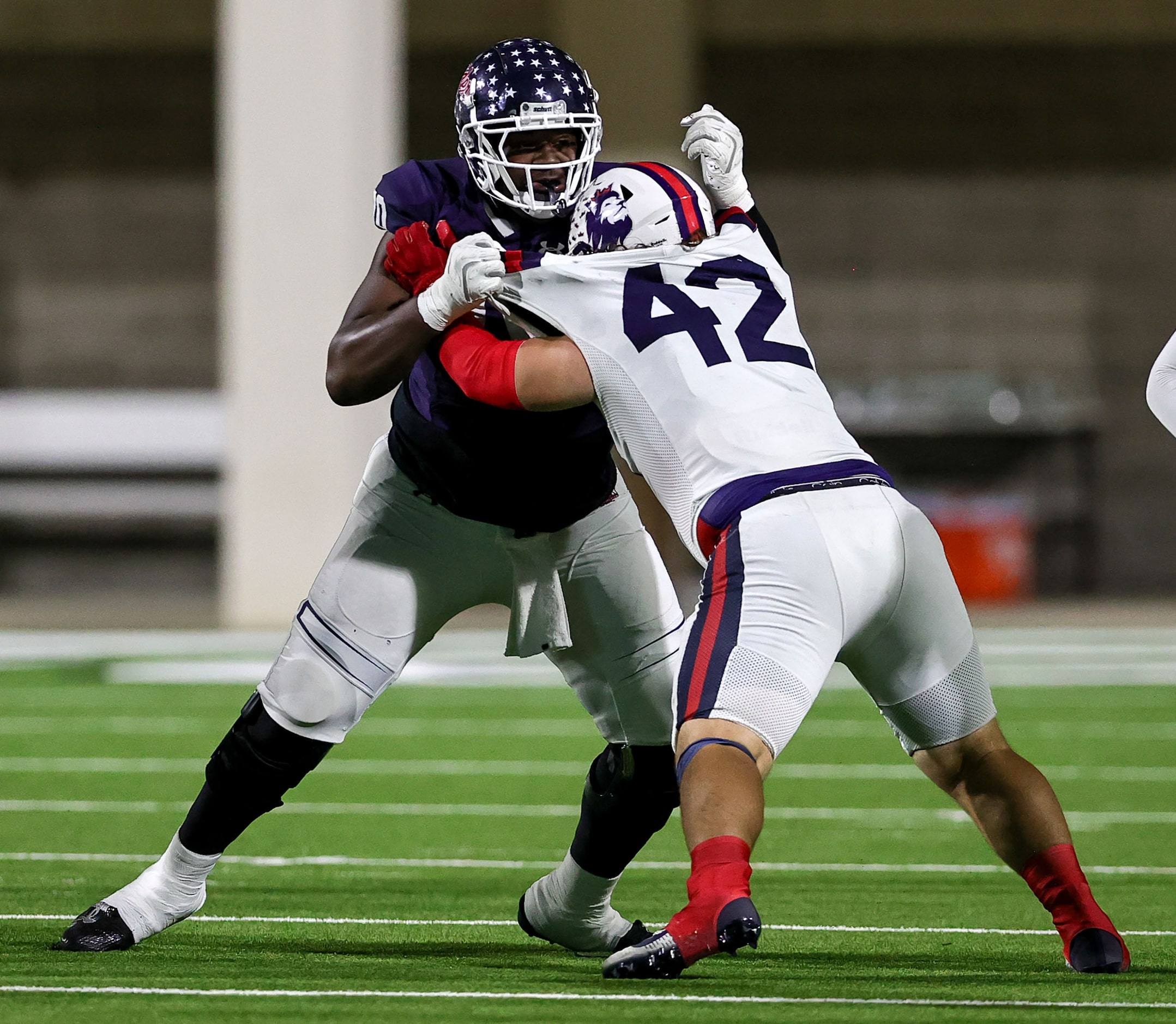 Denton Ryan offensive lineman Ty Haywood blocks Richland defensive lineman Brandon Merino...