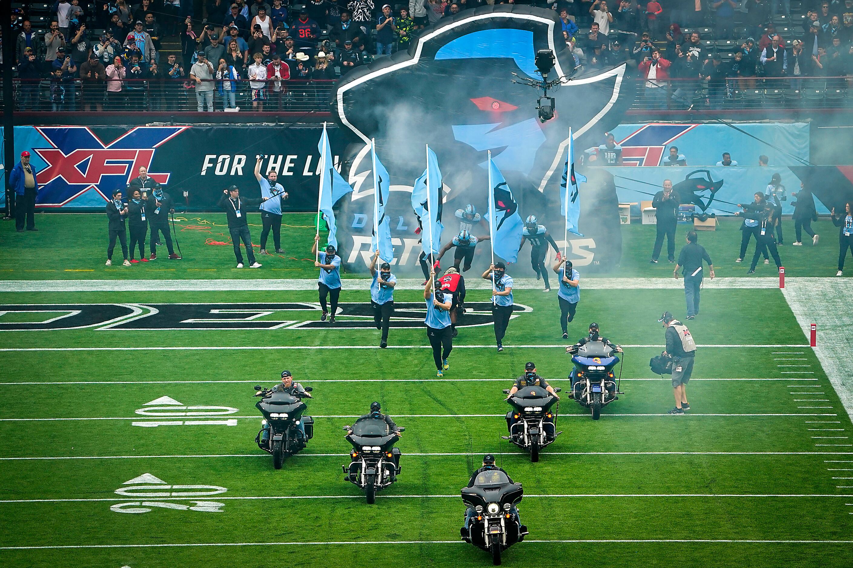 Dallas Renegades player take the field for the team's inaugural XFL football game against...