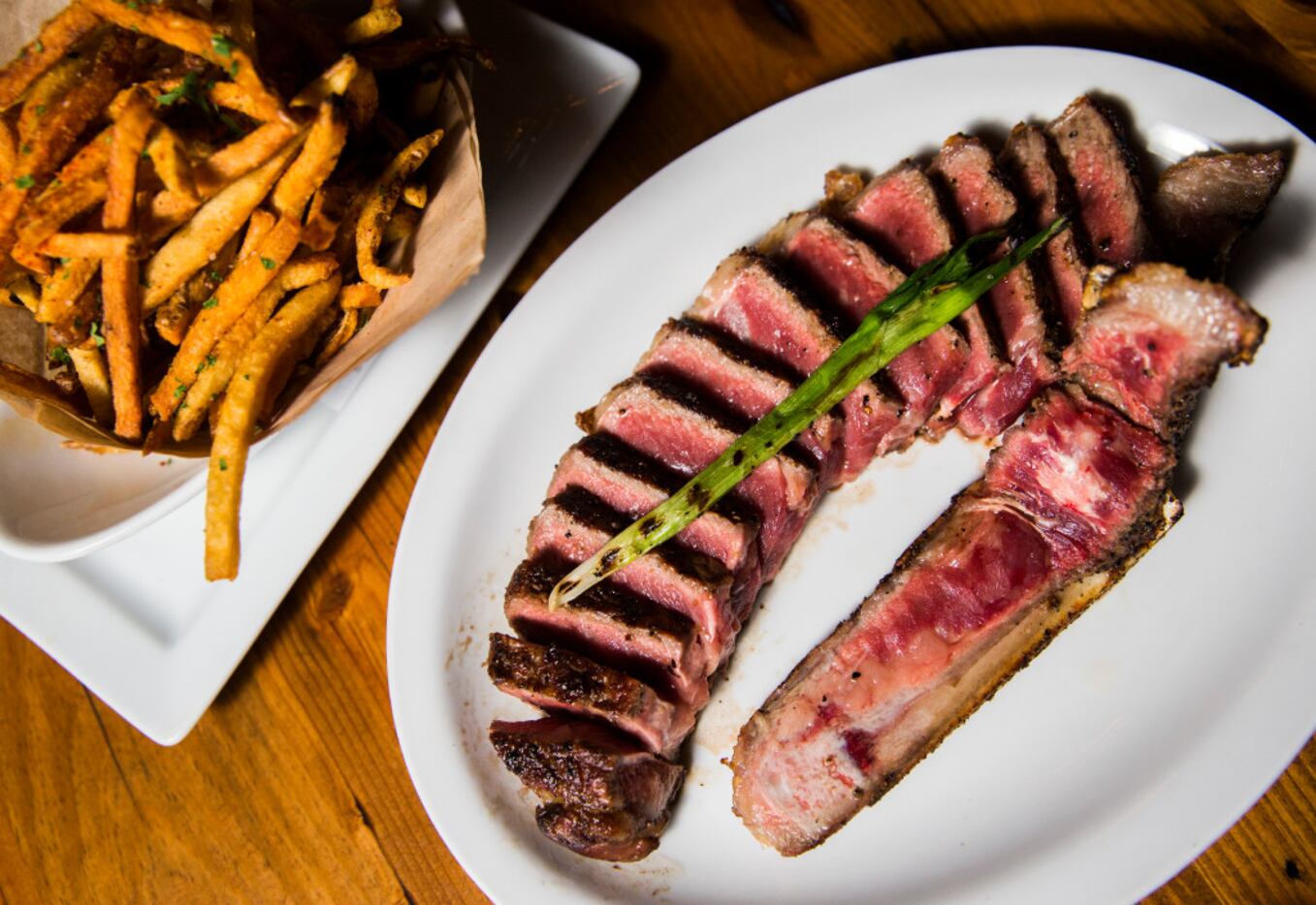 "The Brick" – a 24-ounce, 45-day dry-aged strip steak at Town Hearth  (Ashley Landis/The...