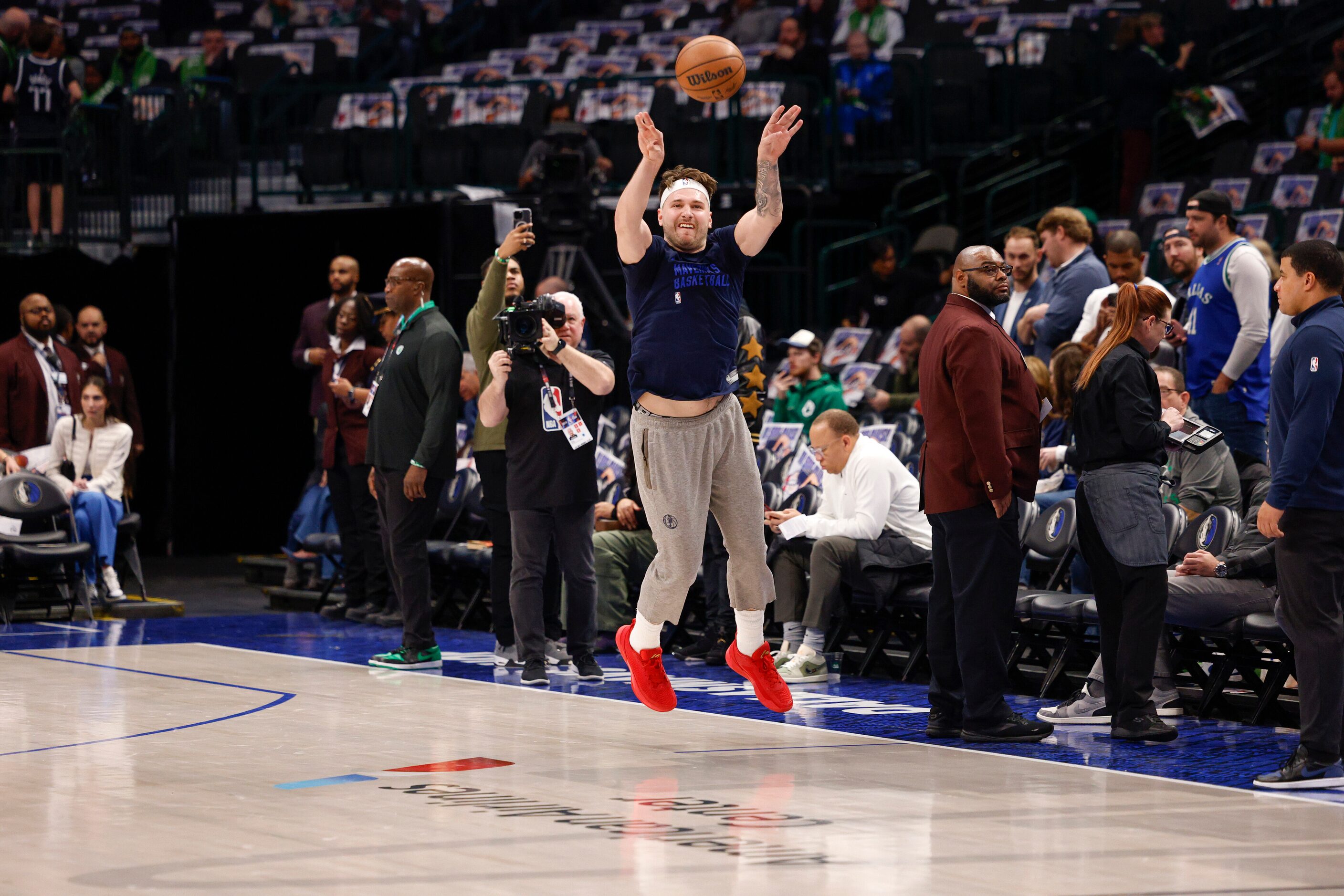 Dallas Mavericks guard Luka Doncic shoots a three-quarter court shot before an NBA game...