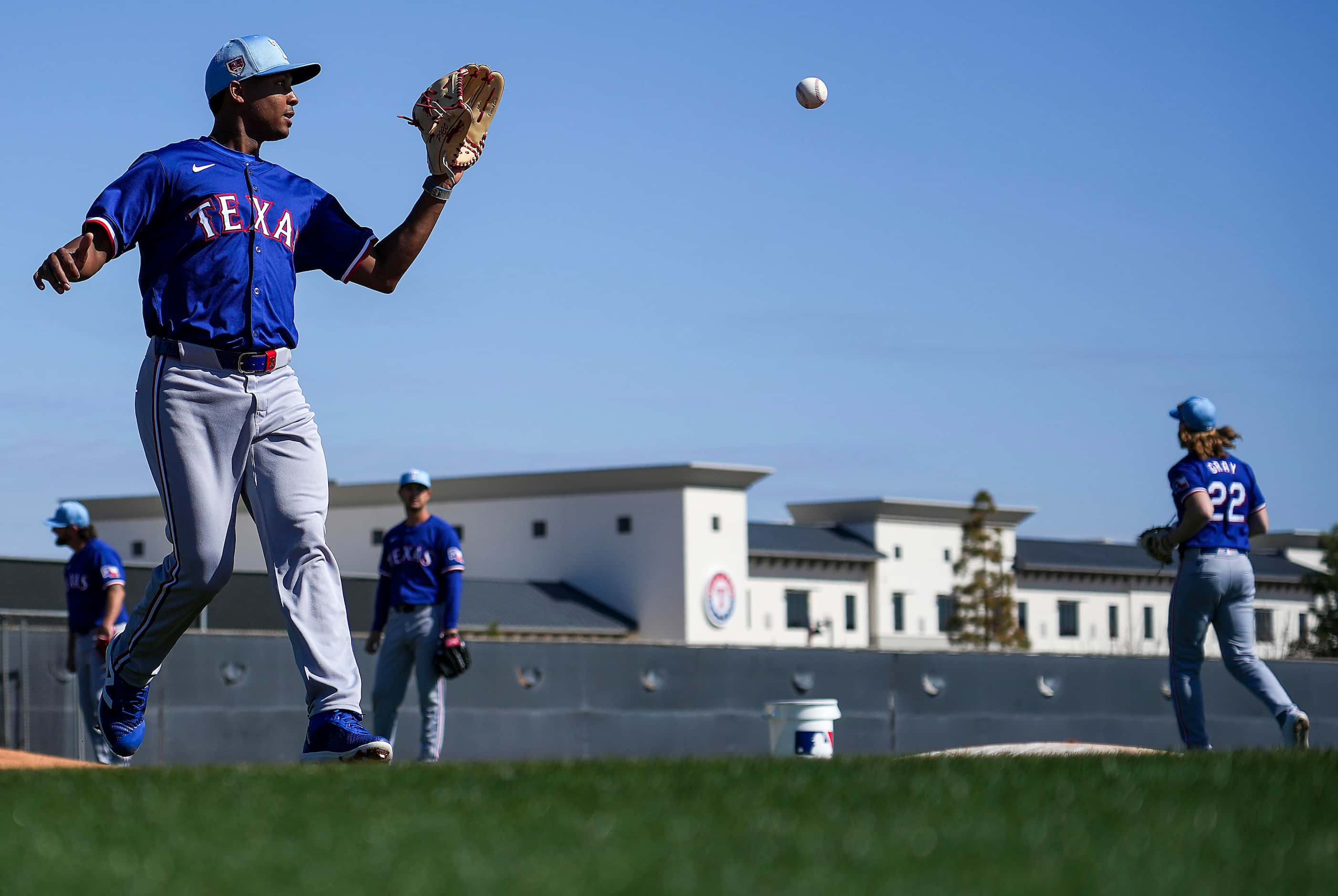 Texas Rangers pitcher José Leclerc participates in a fielding drill during a spring training...