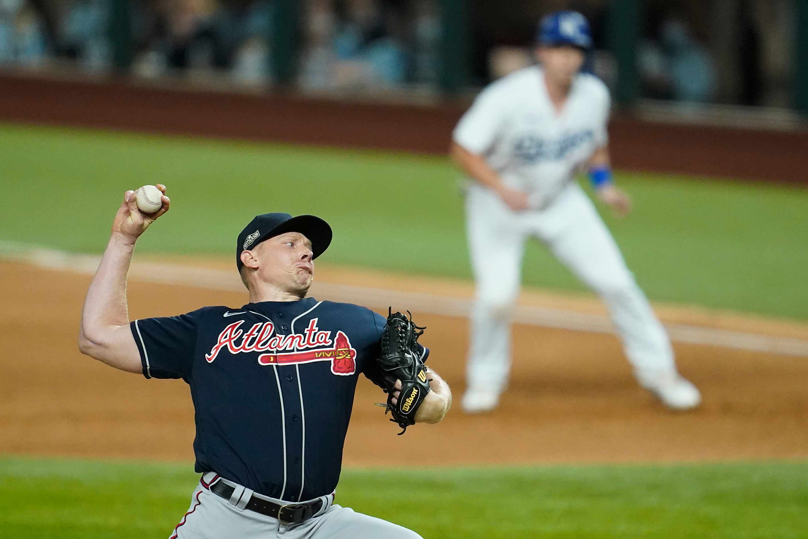 Atlanta Braves relief pitcher Mark Melancon delivers as Los Angeles Dodgers catcher Will...