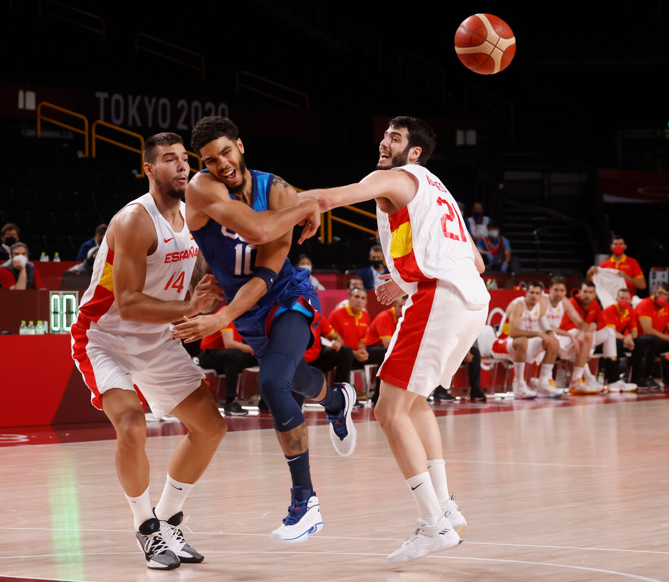 USA’s Jayson Tatum (10) passes out of a double team from Spain’s Willy Hernangomez (14) and...