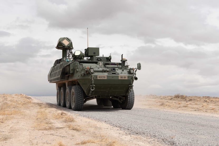A 50 kilowatt laser from Raytheon is mounted on a U.S. Stryker vehicle during live-fire...
