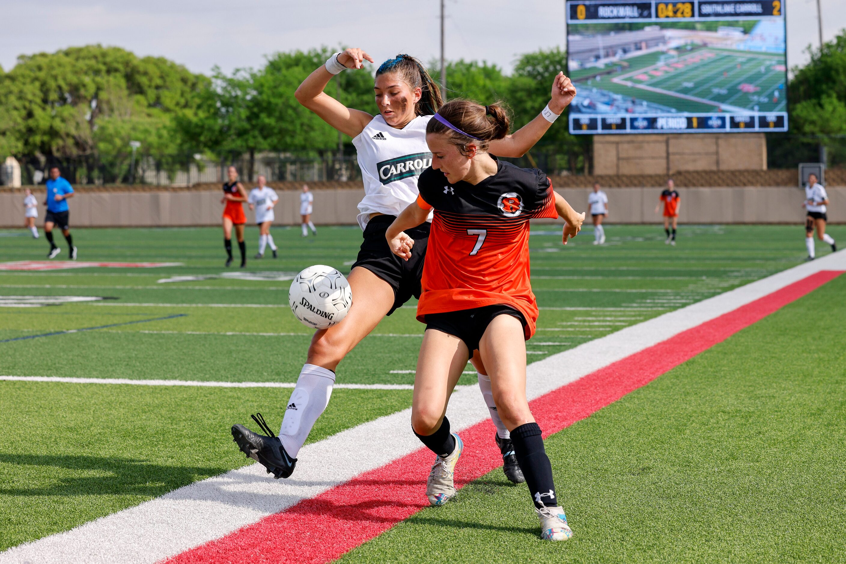 Rockwall defender Brinlee Weir (7) defends against Southlake Carroll forward Madison Khan...