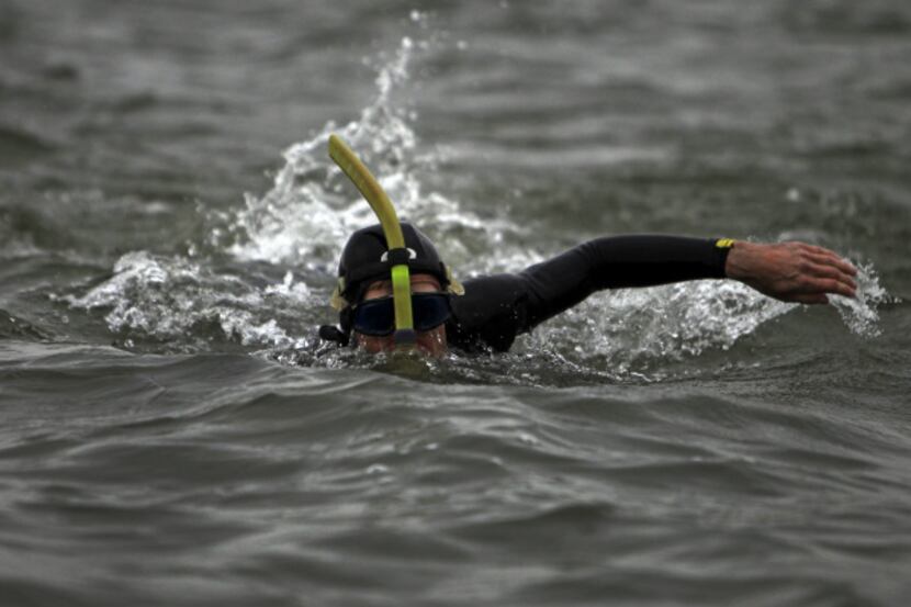 Ben Lecomte swims at Joe Pool Lake as he continues preparations to swim the Pacific Ocean in...