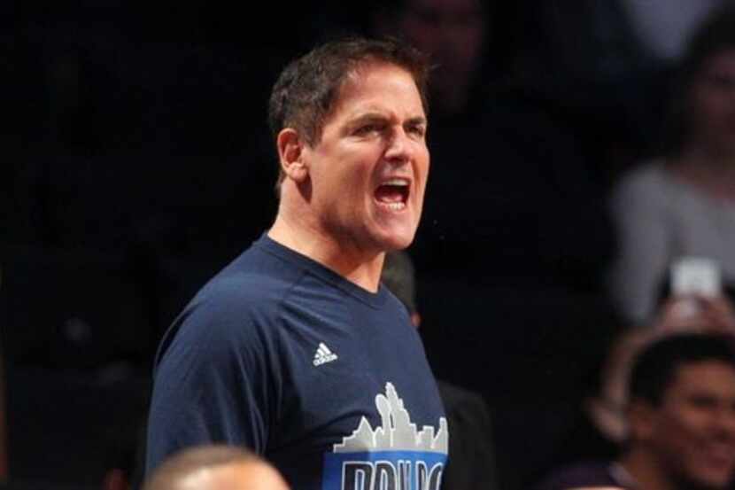 Dec 23, 2015; Brooklyn, NY, USA; Dallas Mavericks owner Mark Cuban cheers from behind the...