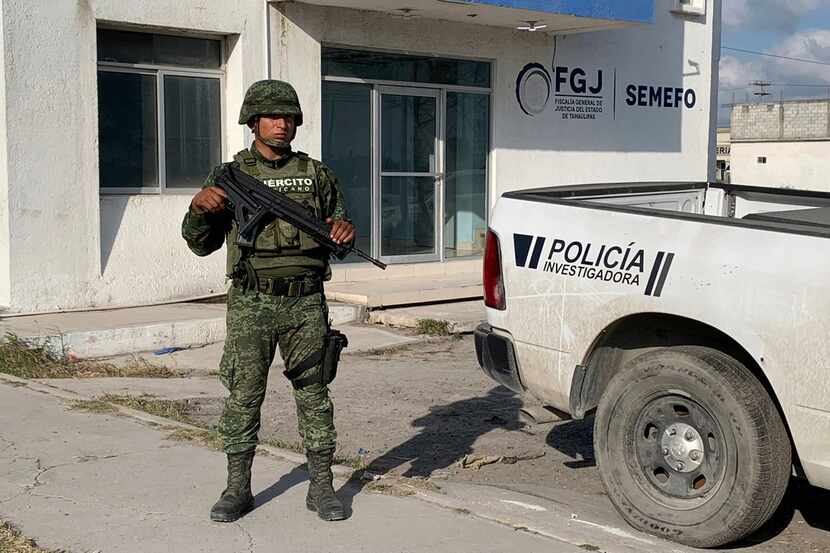 A Mexican army soldier guards the Tamaulipas State Prosecutor's headquarters in Matamoros,...