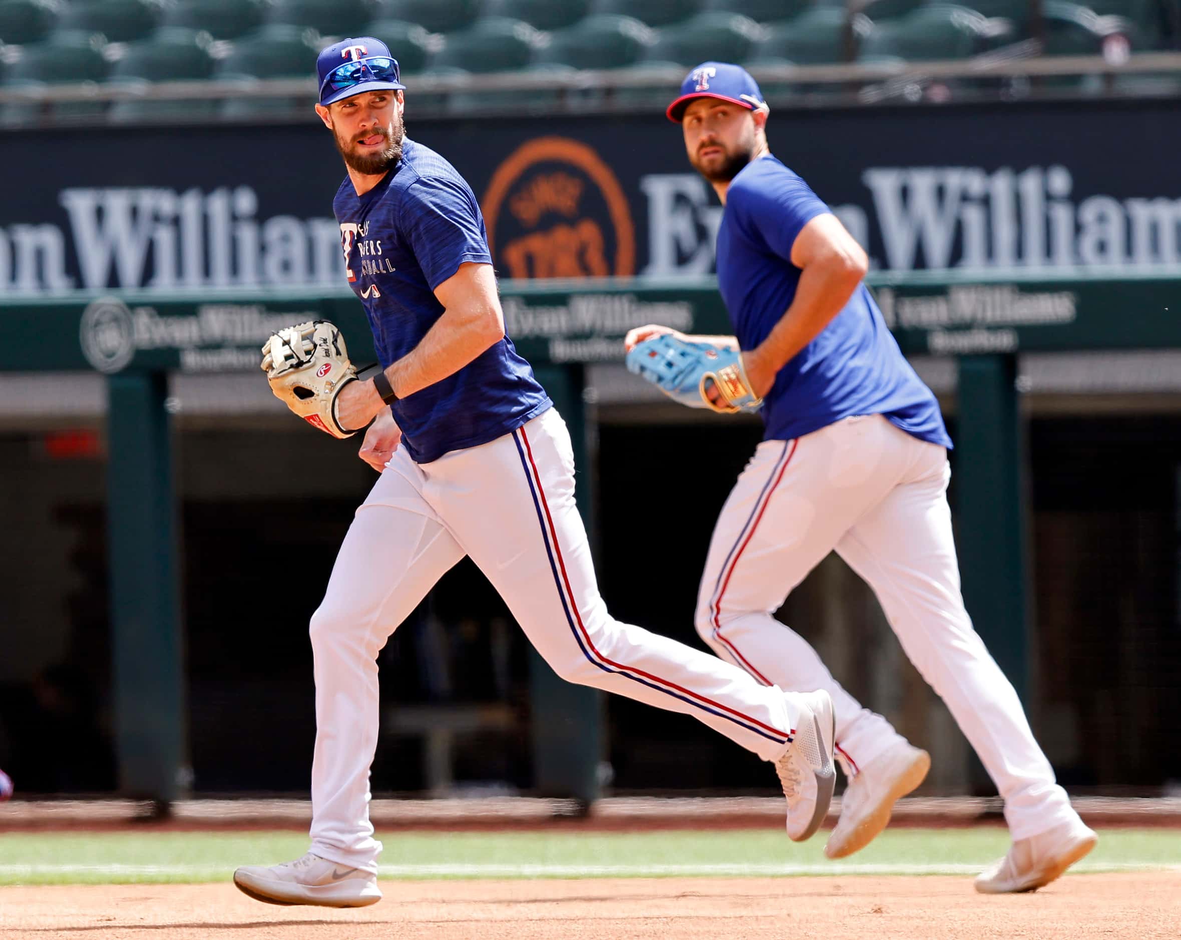 Texas Rangers David Dahl (left) and Joey Gallo take the field for batting practice before...