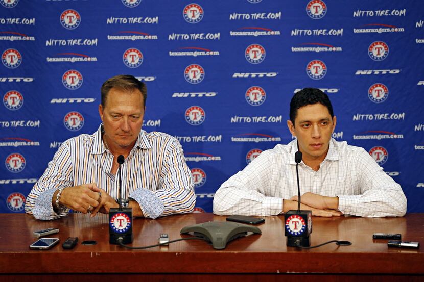 Texas Rangers general manager Jon Daniels (right) talks to media manager as manager Jeff...