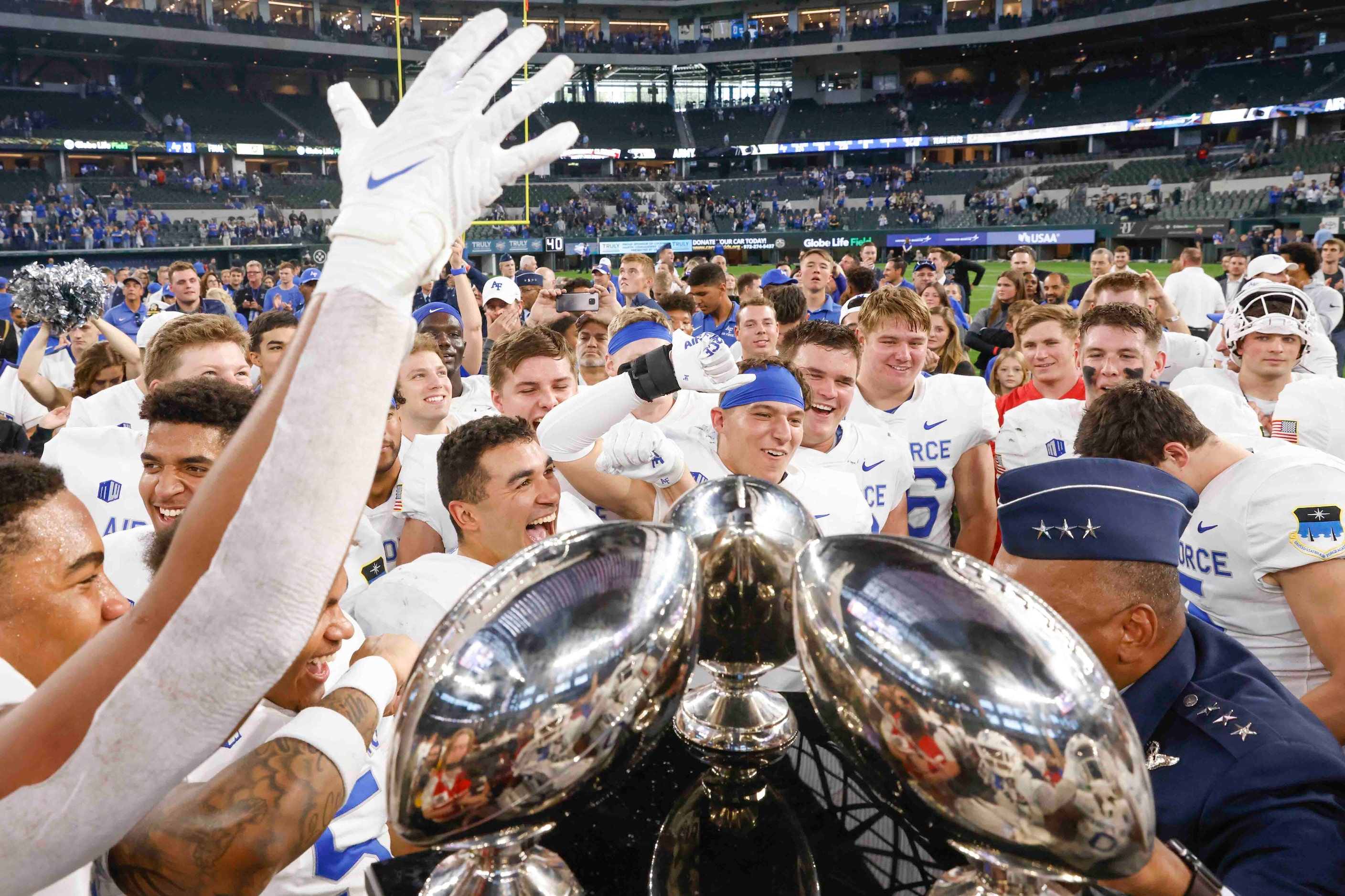 Air Force players celebrate their win against Army during an NCAA football game at Globe...