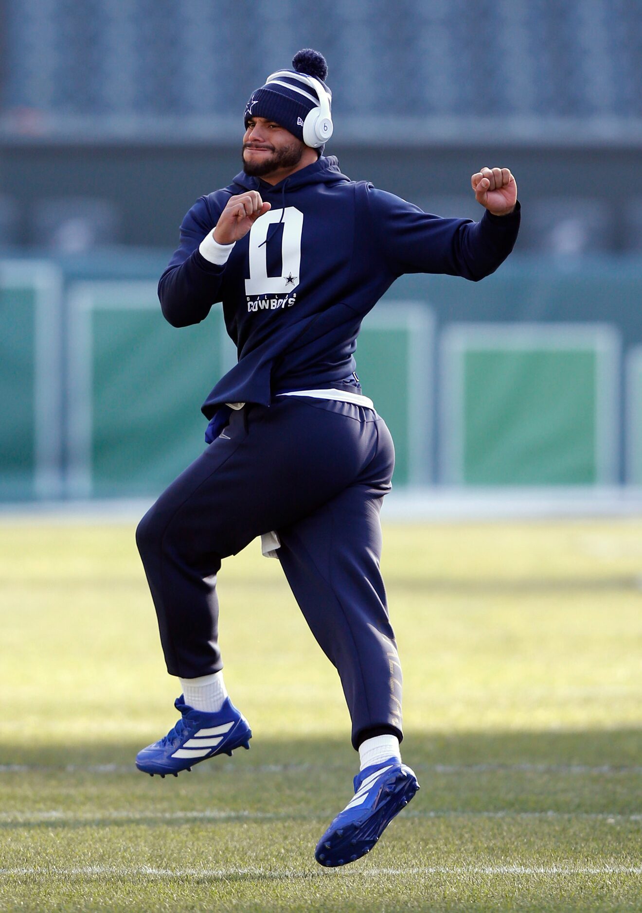 Dallas Cowboys quarterback Dak Prescott (4) stretches  before warmups prior to a game...