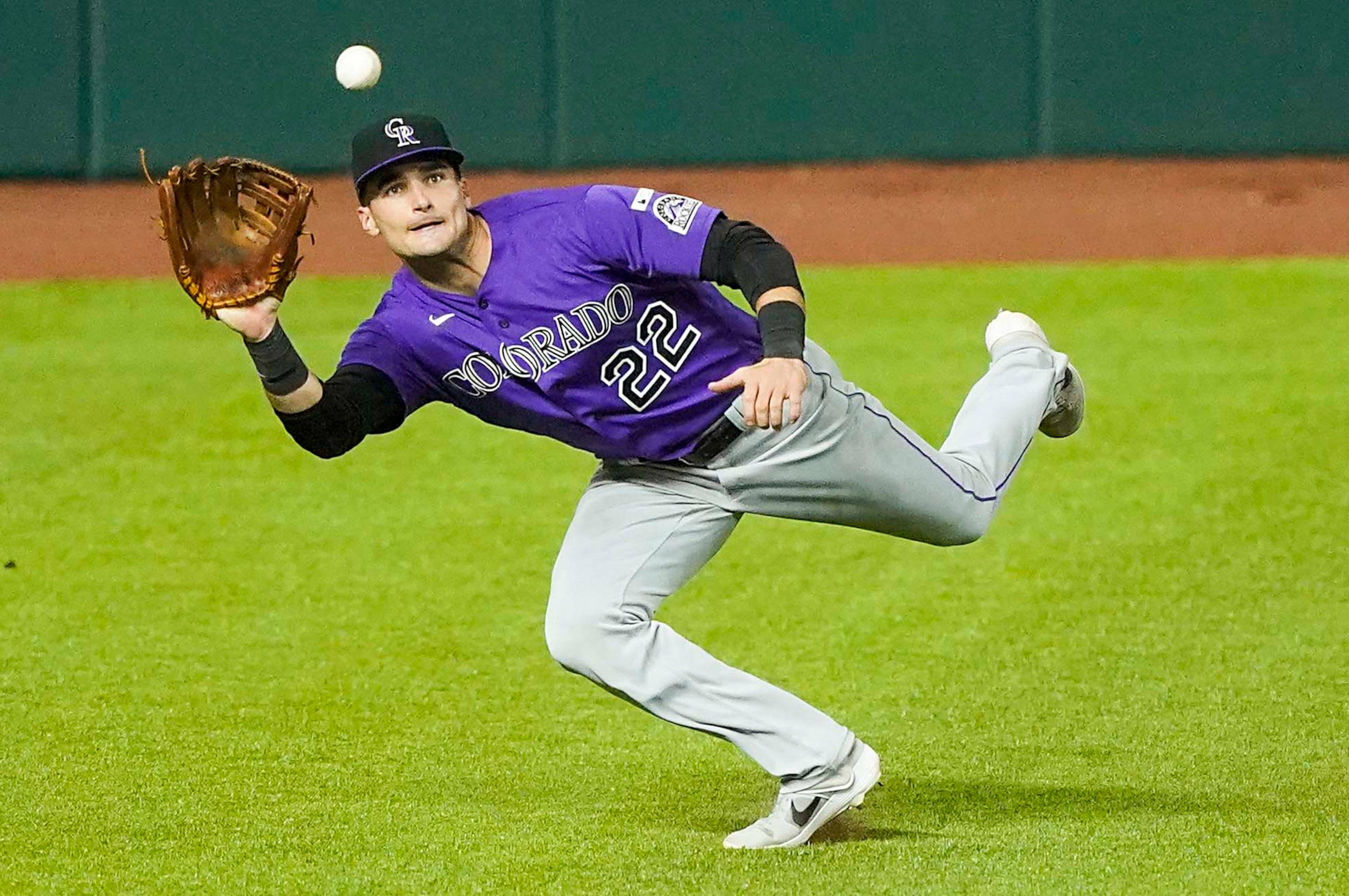 Colorado Rockies left fielder Sam Hilliard makes a running catch on a line drive off the bat...