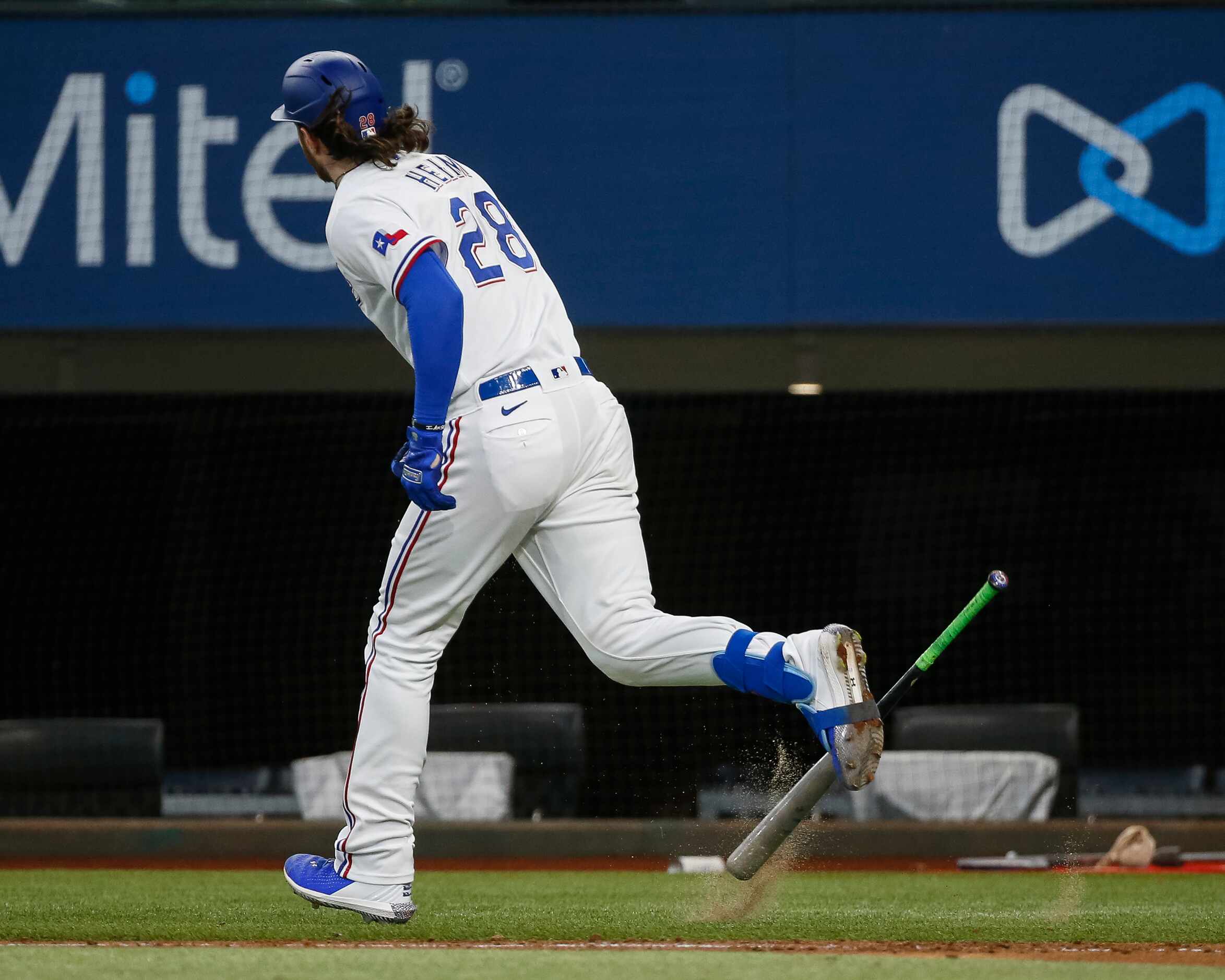 Texas Rangers catcher Jonah Heim (28) slams his bat after hitting a flyball for an out...