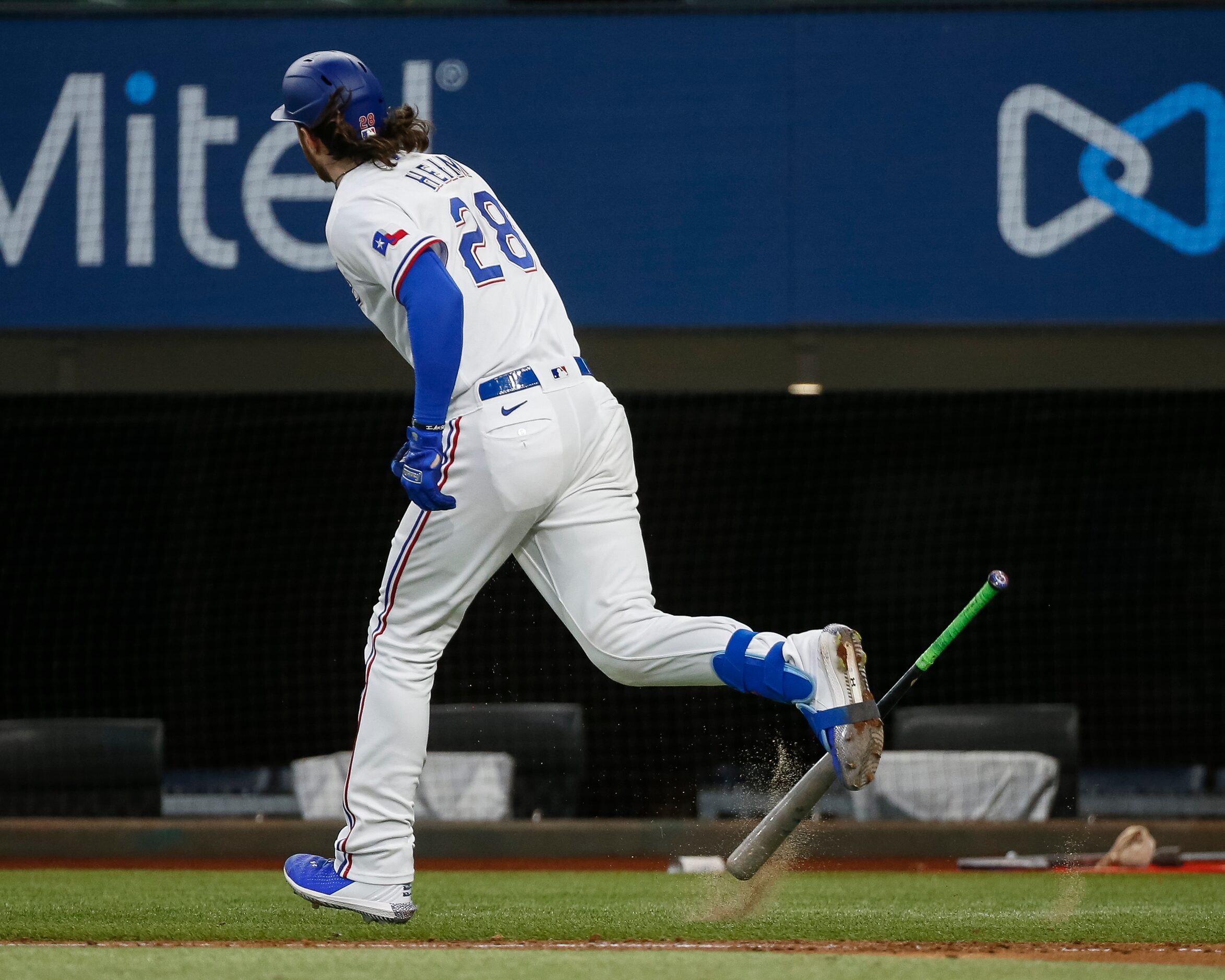 Texas Rangers catcher Jonah Heim (28) slams his bat after hitting a flyball for an out...