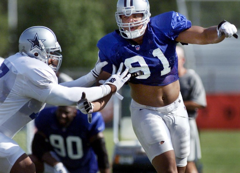 Cowboys DE Dimitrius Underwood tries to get around teammate Solomon Page during an afternoon...