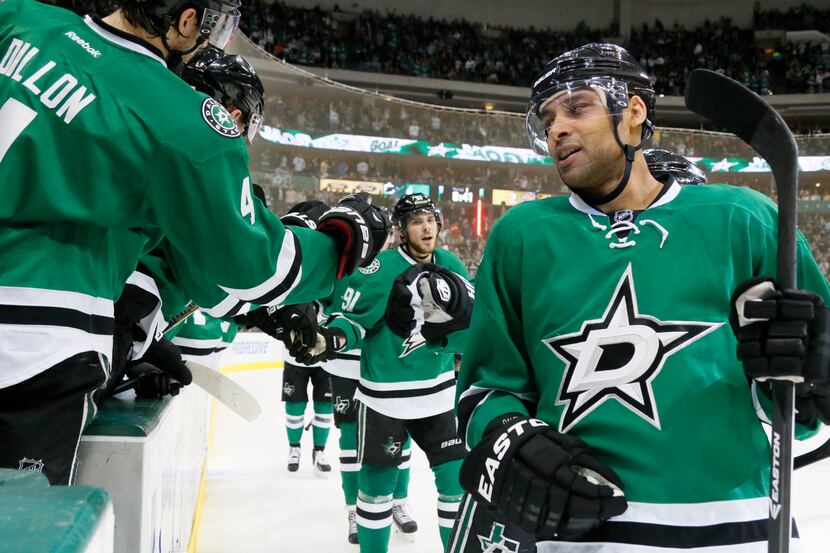 Dallas' Trevor Daley (6) is congratulated by teammates after his second-period goal during...