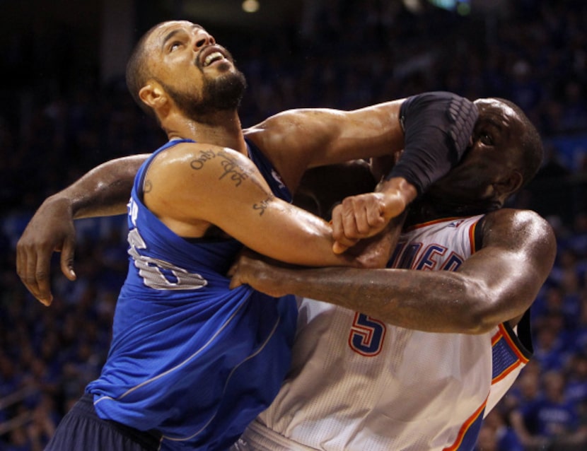 Dallas Mavericks center Tyson Chandler (6) and Oklahoma City Thunder center Kendrick Perkins...