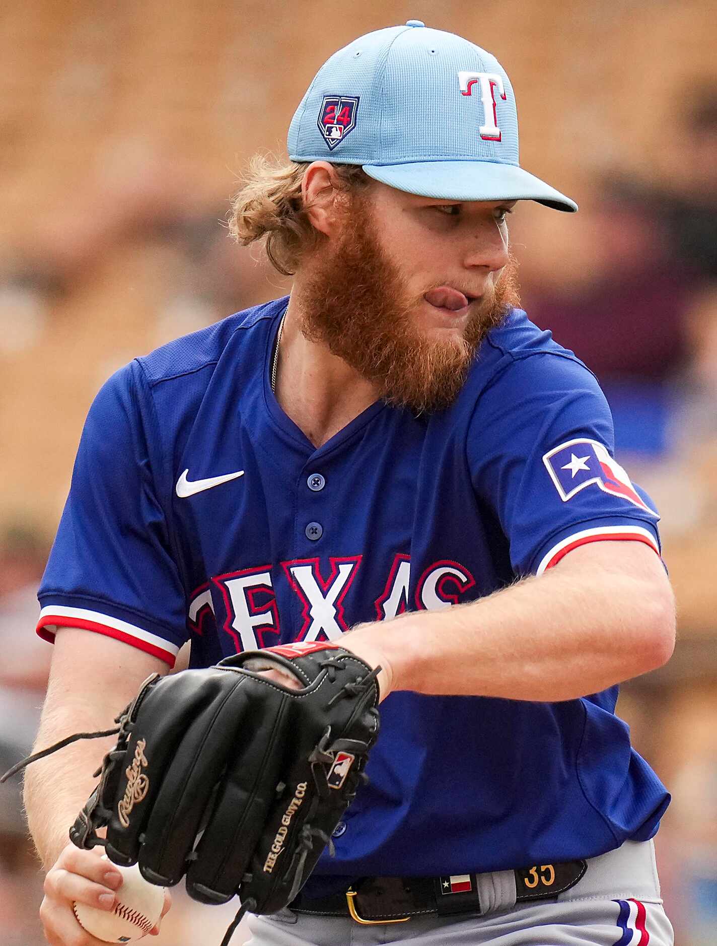 Texas Rangers pitcher Zak Kent delivers during the third inning of a spring training game...